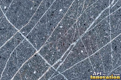 Blue gray granite with thin pale quartz veins cutting across it