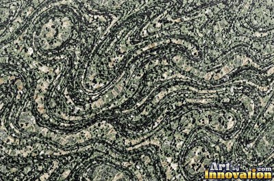 Blue gray granite with thin pale quartz veins cutting across it