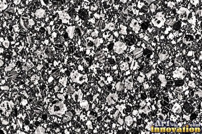 Blue gray granite with thin pale quartz veins cutting across it