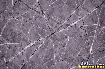 Bold dramatic marble veining in thick sweeping bands of ivory and gold