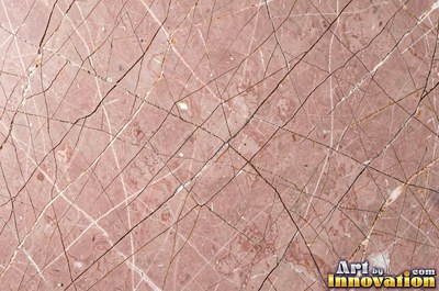 Tumbled slate blue marble with soft worn edges and faded veins