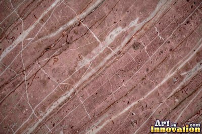Bold dramatic marble veining in thick sweeping bands of ivory and gold