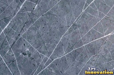 Tumbled slate blue marble with soft worn edges and faded veins