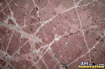 Bold dramatic marble veining in thick sweeping bands of ivory and gold