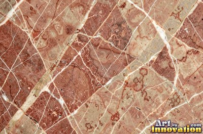 Polished white marble with a few thin gold-like veins