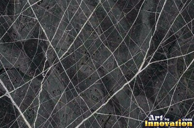 Bold dramatic marble veining in thick sweeping bands of ivory and gold