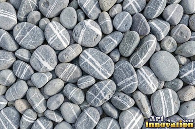 Flat skimming stones overlapping like scales in warm beige