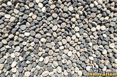 Large smooth blue gray boulders set tight with dark gaps
