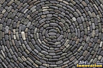 Earthy brown flat stones overlapping across the whole frame