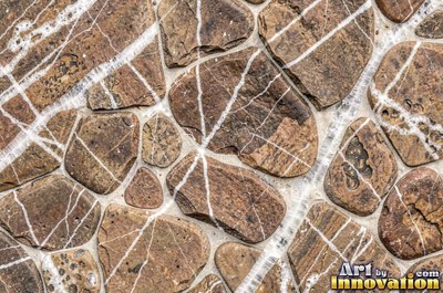 Earthy brown flat stones overlapping across the whole frame