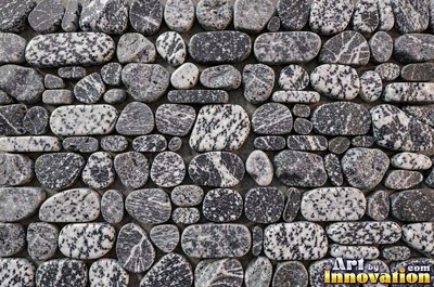 Large smooth blue gray boulders set tight with dark gaps