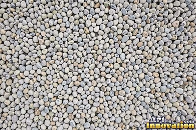 Smooth river pebbles packed tightly in salt and pepper tones