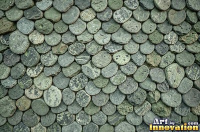 Large smooth blue gray boulders set tight with dark gaps