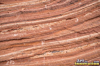 Sandstone with fossil ripple marks across it in sandy tan