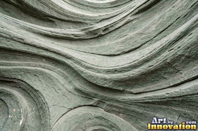Sandstone with fossil ripple marks across it in sandy tan