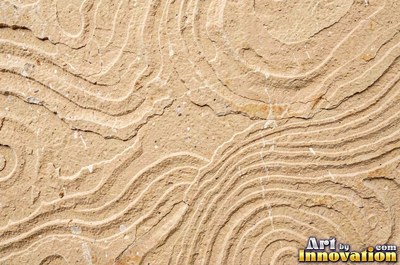 Polished warm beige sandstone showing fine sand grains