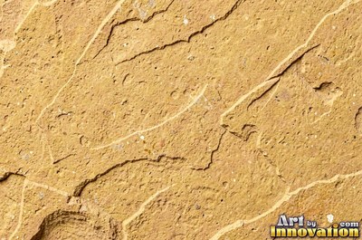 Polished warm beige sandstone showing fine sand grains