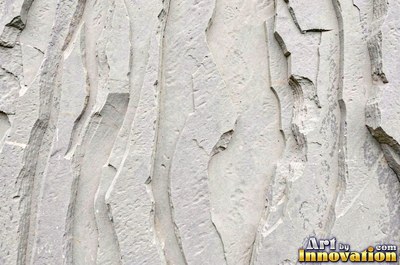 Sandstone with fossil ripple marks across it in sandy tan