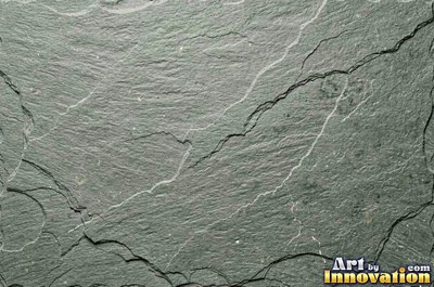 Dry stacked stone wall of flat blue gray slate pieces