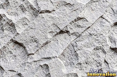 Stratified sedimentary rock in thin bands of sandy tan