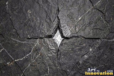 Dry stacked stone wall of flat blue gray slate pieces
