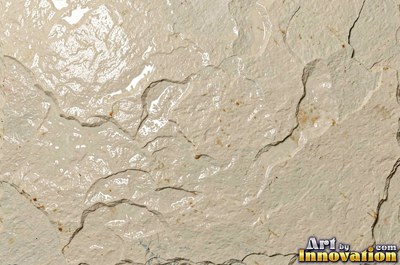 Cleft slate surface with natural ripples and ridges in near black