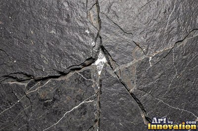 Stratified sedimentary rock in thin bands of sandy tan