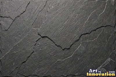 Dry stacked stone wall of flat blue gray slate pieces