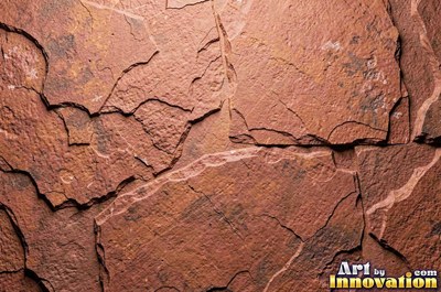 Stratified sedimentary rock in thin bands of sandy tan