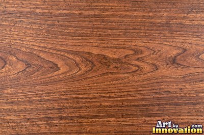 Rough sawn wood with circular saw marks crossing the open grain