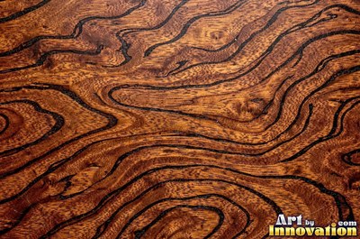 Flowing cathedral grain arches in a planed hardwood board