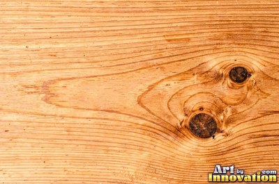 Flowing cathedral grain arches in a planed hardwood board