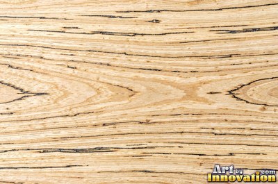 Tight quarter sawn wood grain with shimmering ray flecks along the board