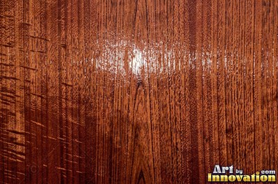 Rough sawn wood with circular saw marks crossing the open grain