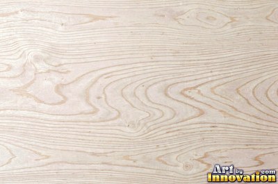 Rough sawn wood with circular saw marks crossing the open grain