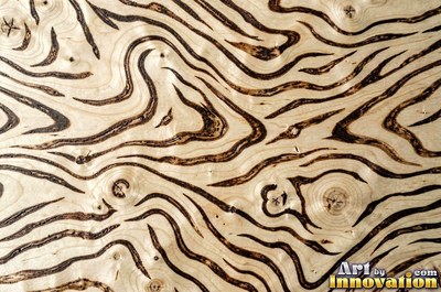 Flowing cathedral grain arches in a planed hardwood board