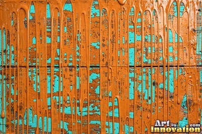 Peeling emerald paint curling off a wooden door in long flakes