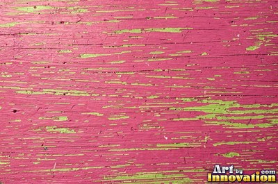 Dry brushed violet paint streaked thin over rough sawn wood