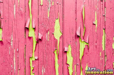 Distressed painted planks rubbed through to bare wood along every edge