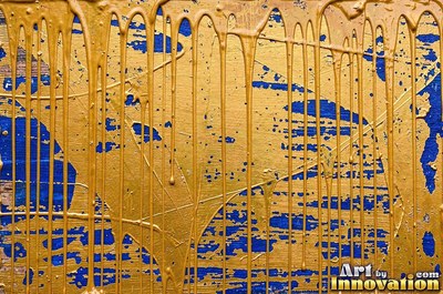 Layers of old royal blue paint sanded back in patches like a map