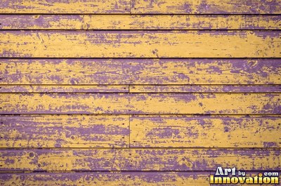 Distressed painted planks rubbed through to bare wood along every edge