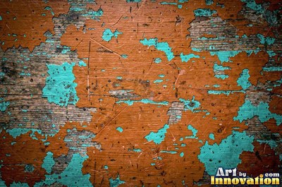 Layers of old royal blue paint sanded back in patches like a map