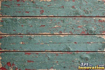 Distressed painted planks rubbed through to bare wood along every edge