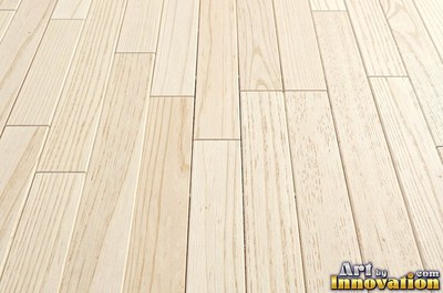 Rows of narrow hardwood floor planks in staggered courses with tight seams