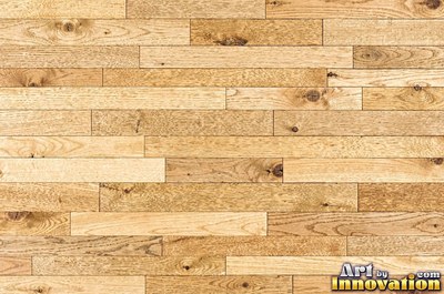 Rows of narrow hardwood floor planks in staggered courses with tight seams