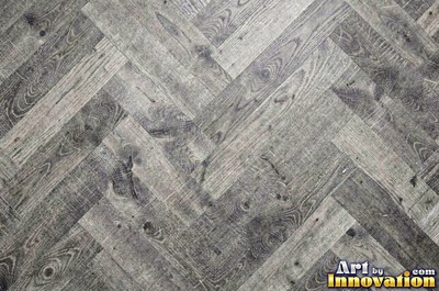Rows of narrow hardwood floor planks in staggered courses with tight seams