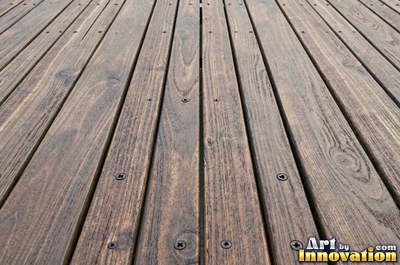 Rows of narrow hardwood floor planks in staggered courses with tight seams