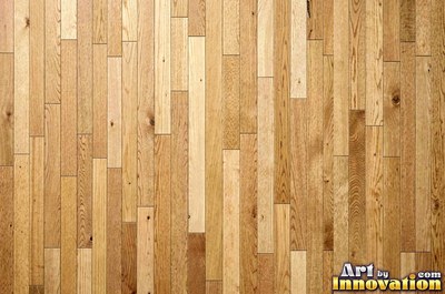 Rows of narrow hardwood floor planks in staggered courses with tight seams