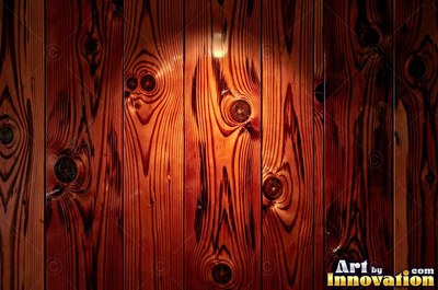 Rough sawn timber boards with faint saw marks under a dark walnut stain