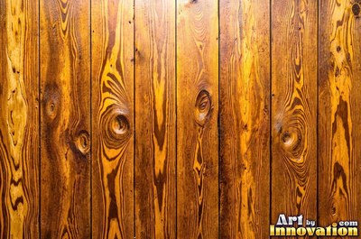 Vertical barn boards in oxblood red stain with every knot showing through